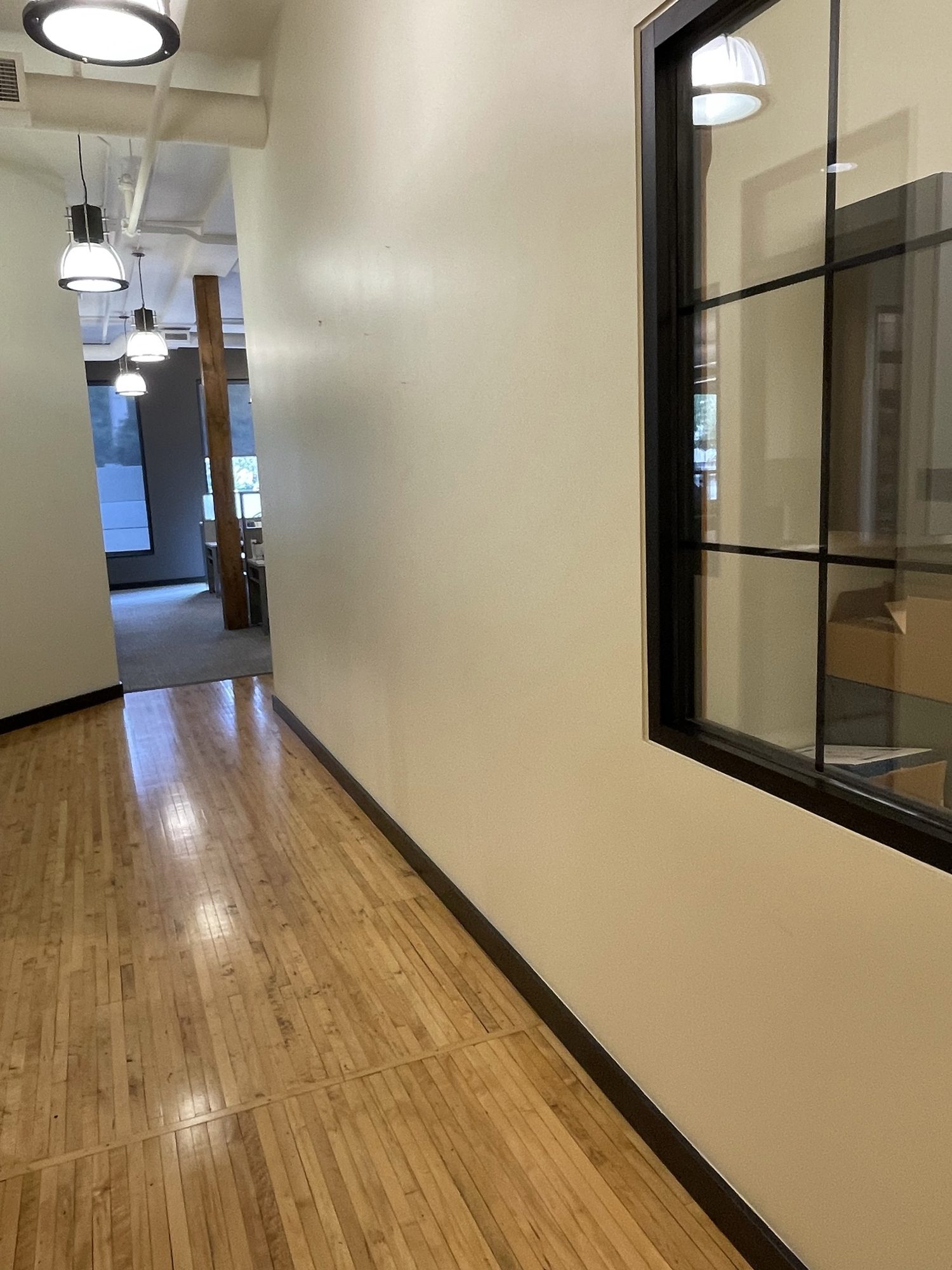 Commercial corridor with wood flooring