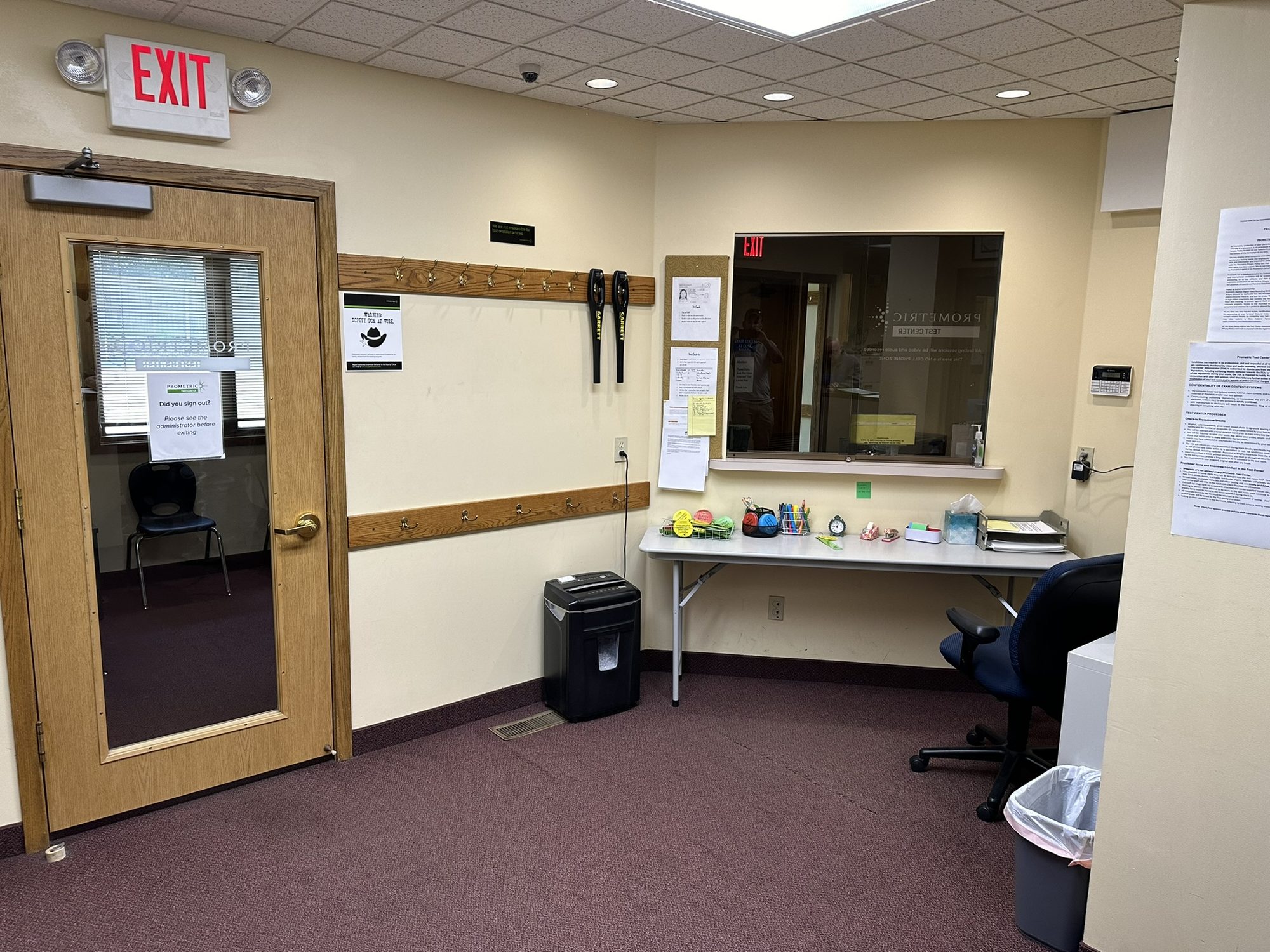 Commercial office reception with service window, workstation, and new finishes