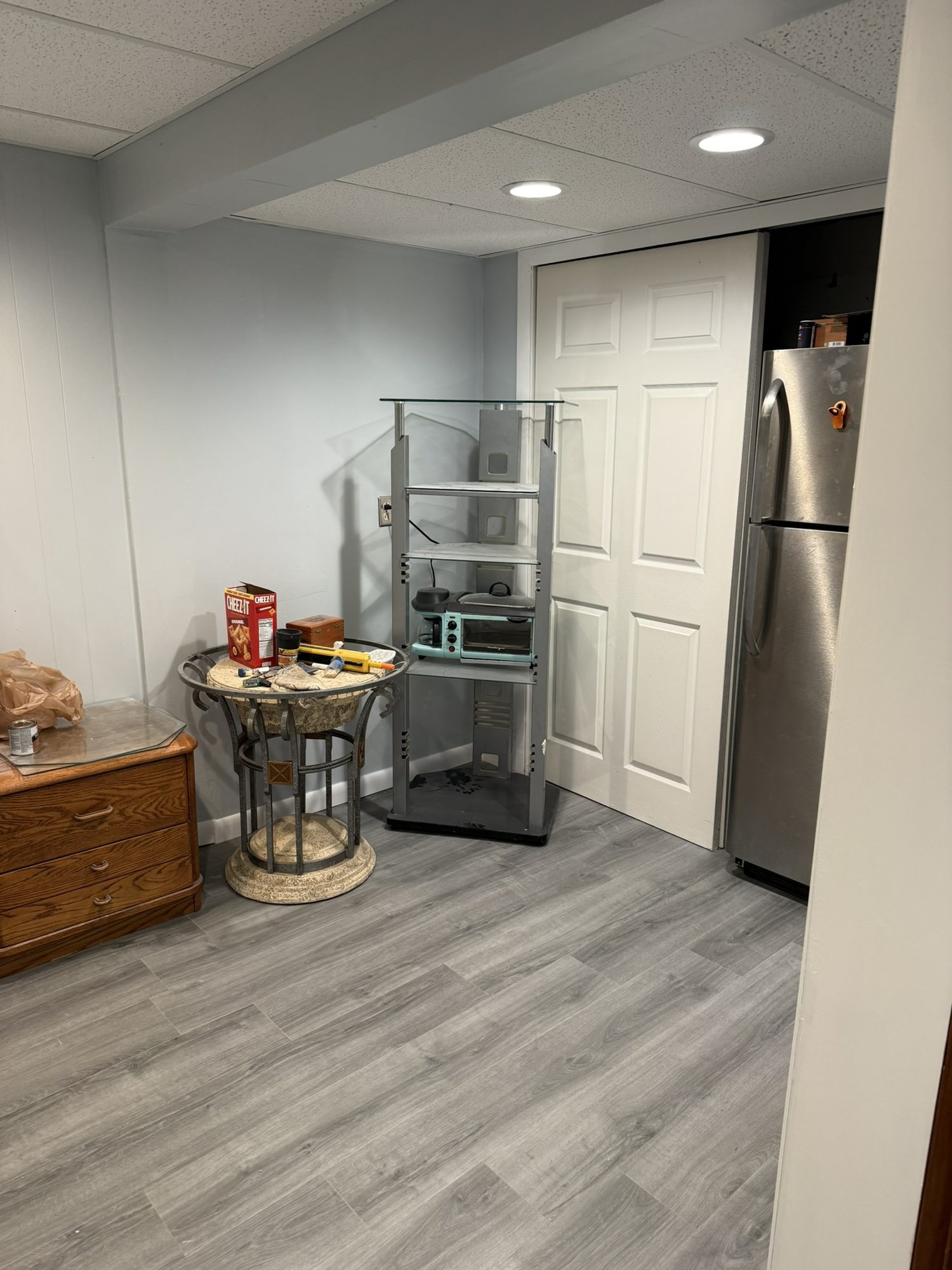 Gray lvt in a finished lower level