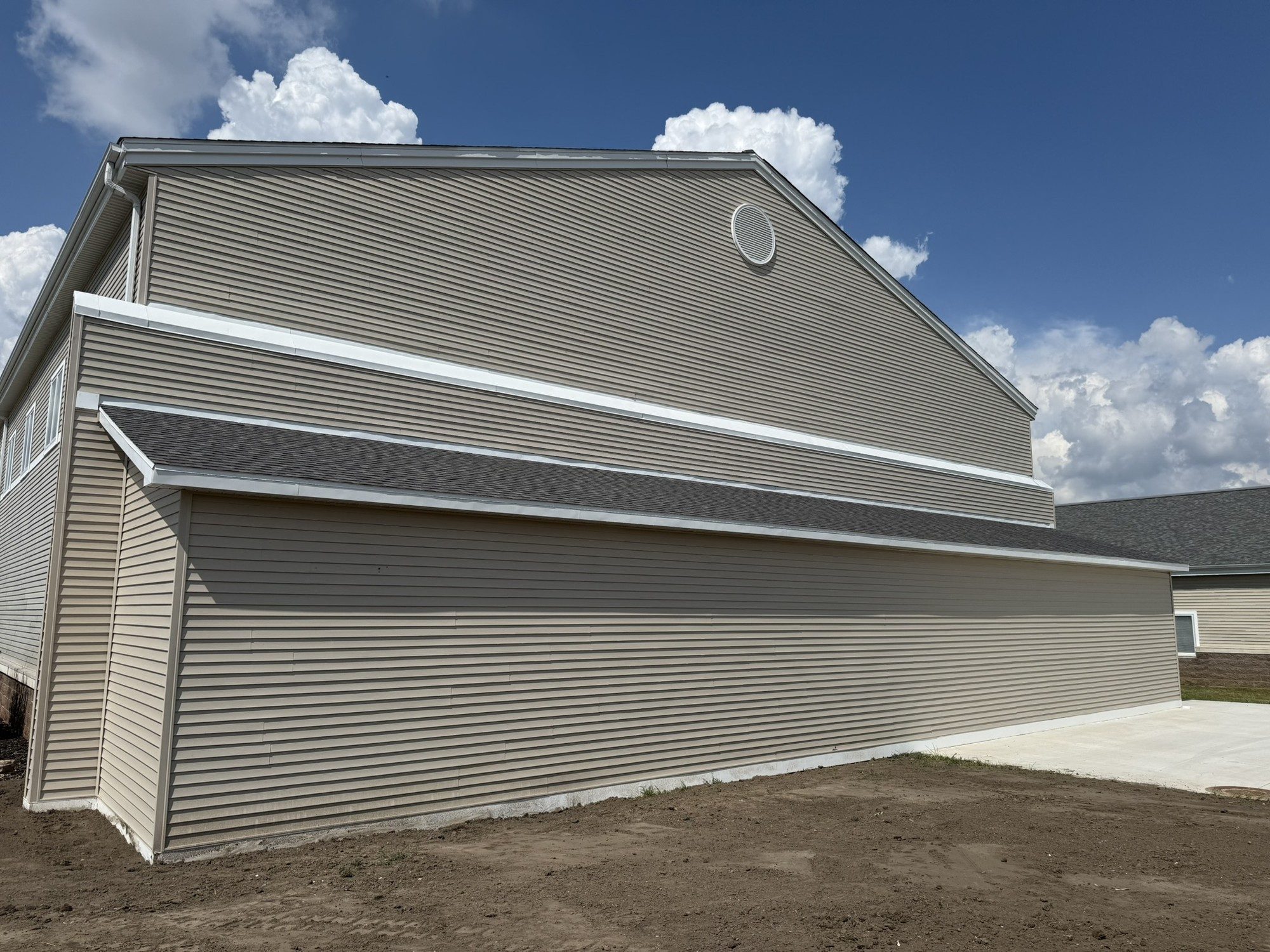Building exterior with new gray steel siding
