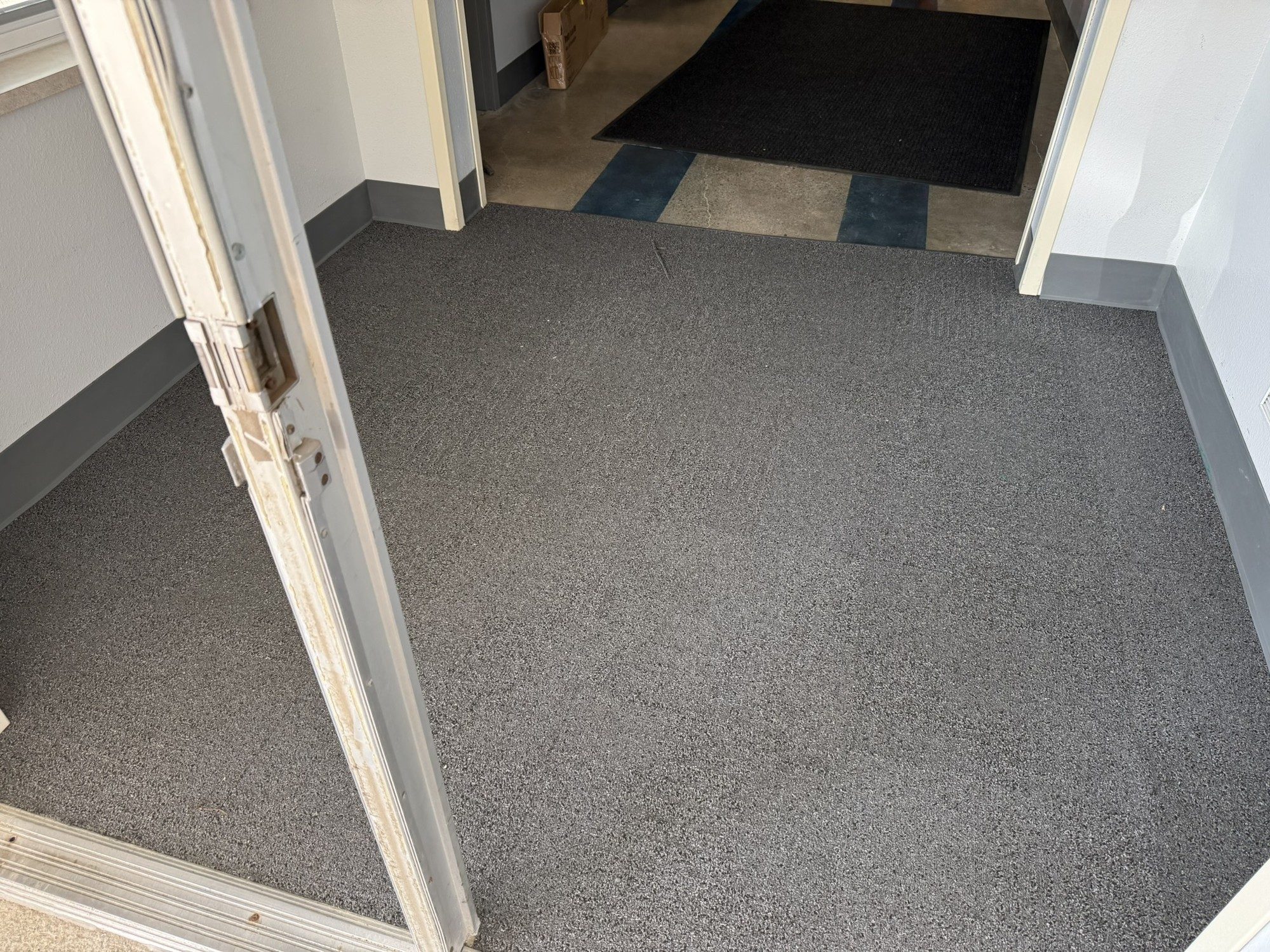 Charcoal walk-off carpet at a building entry
