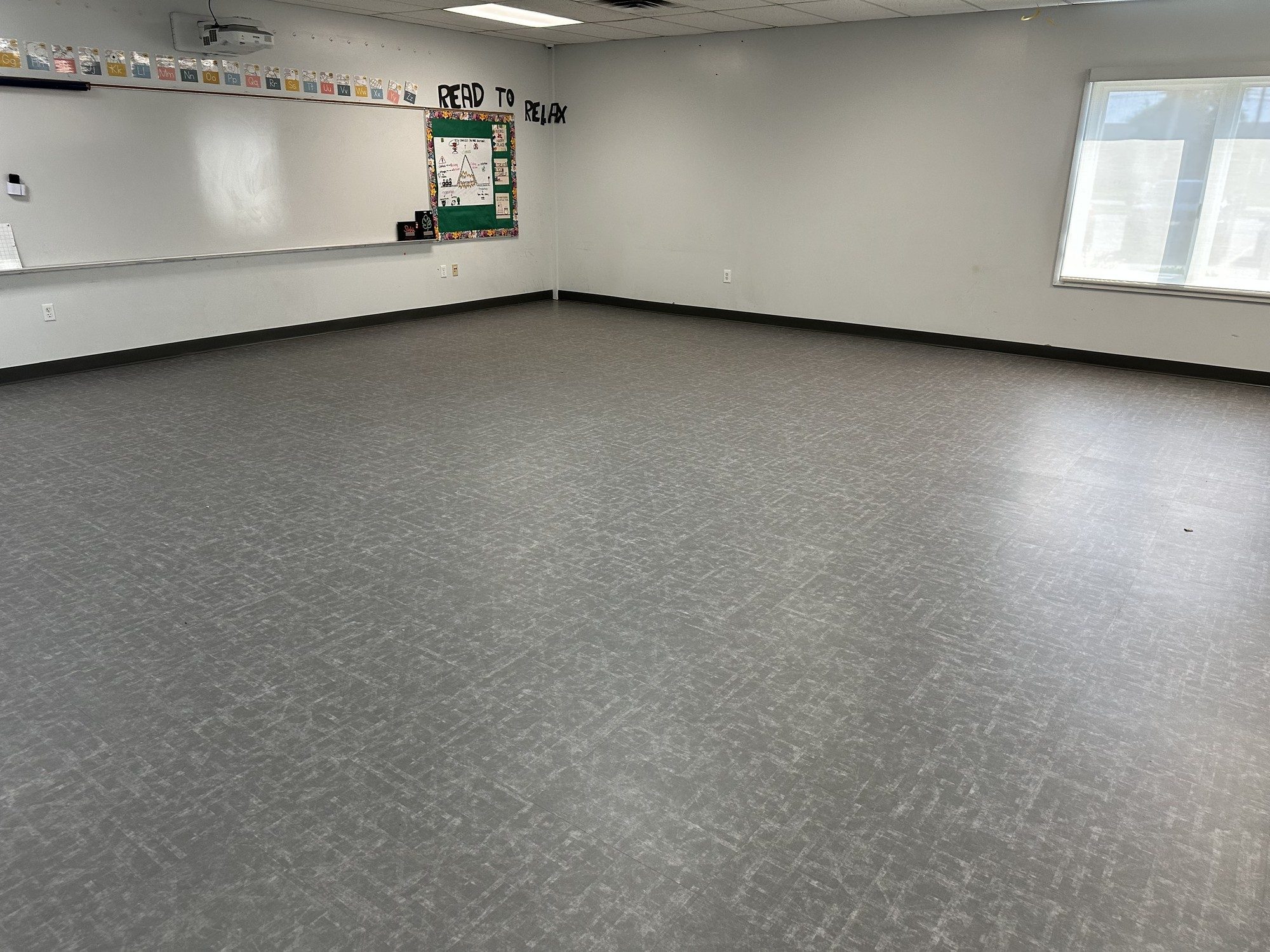 Gray LVT flooring in a large open room