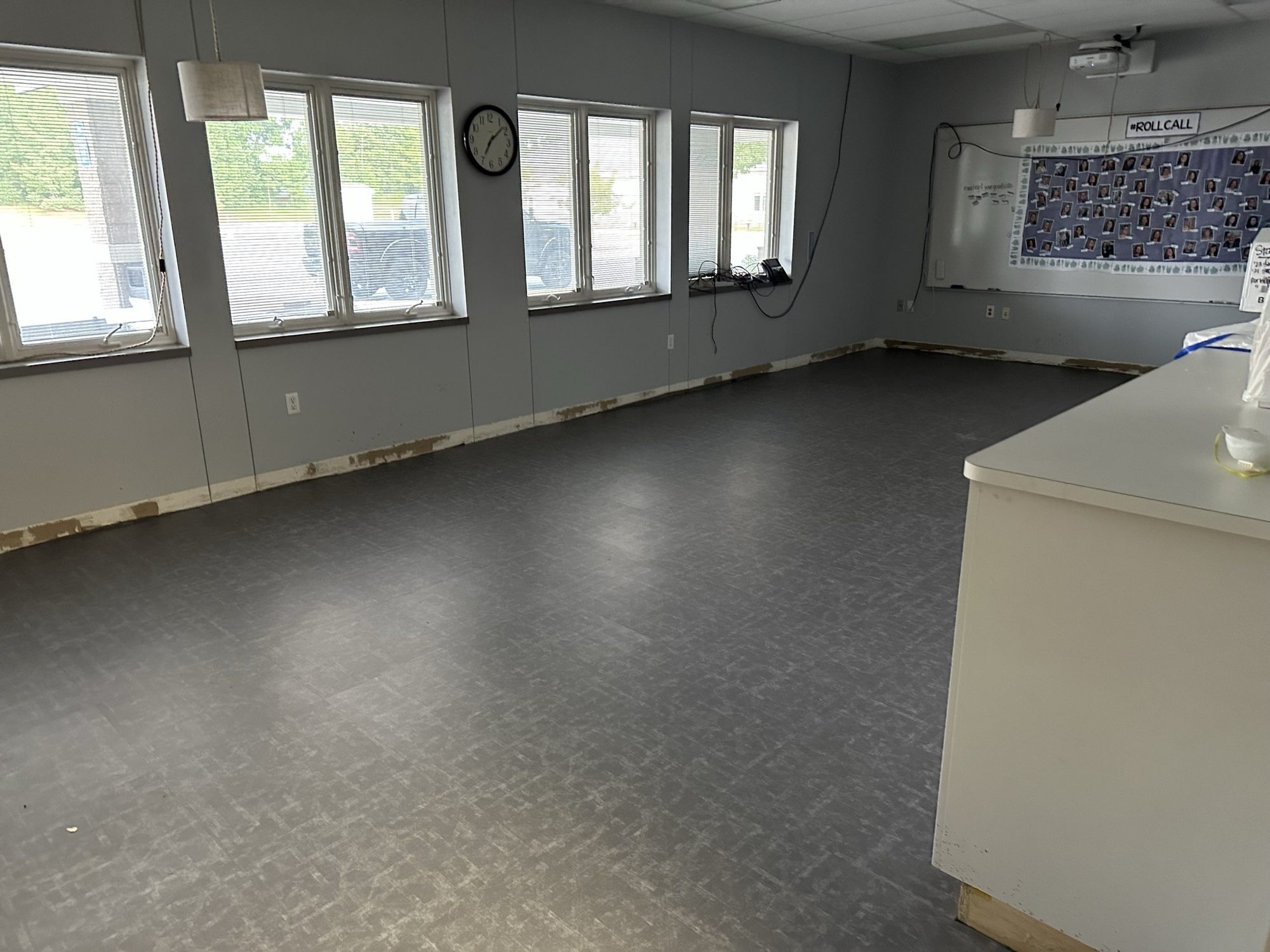 Gray LVT flooring in a large room with windows
